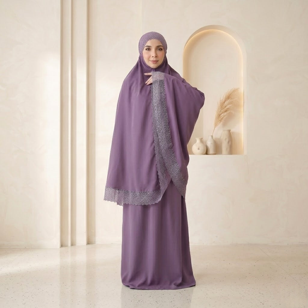 Woman wearing a purple abaya with lace details in a minimalistic setting
